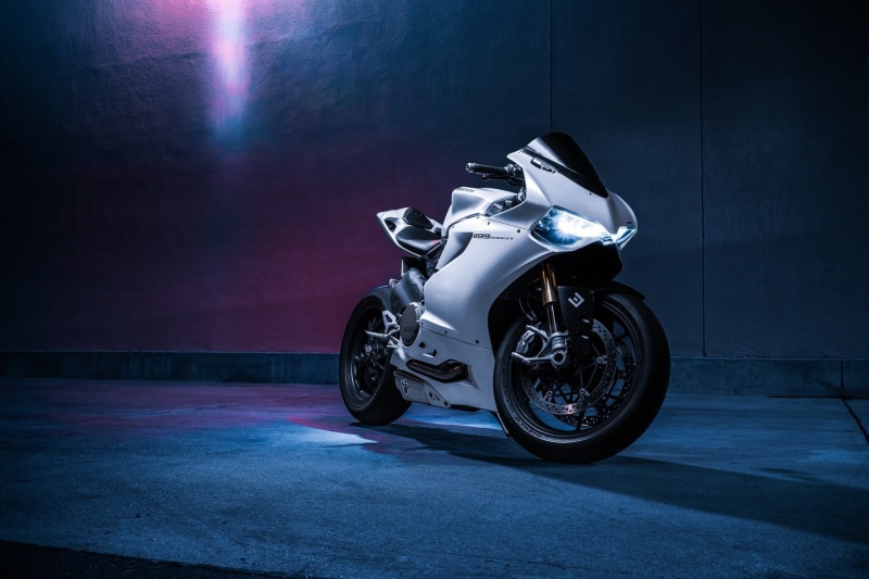 Ducati 1199, single object, indoors, toy, spotlight, night, side view, bike, city, illuminated, sports, chrome, transportation, architecture, stationary