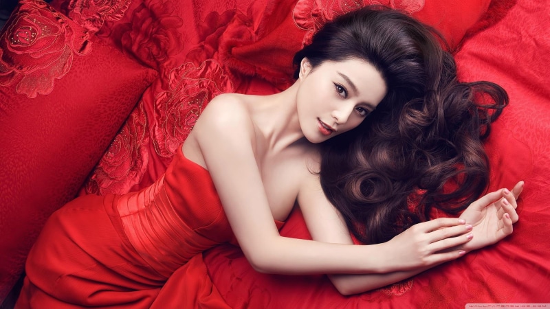 beautiful woman, hair, young adult, luxury, red, one person, dress, beautiful people, lying down, model, hairstyle, clothing, fashion, contemplation, adult
