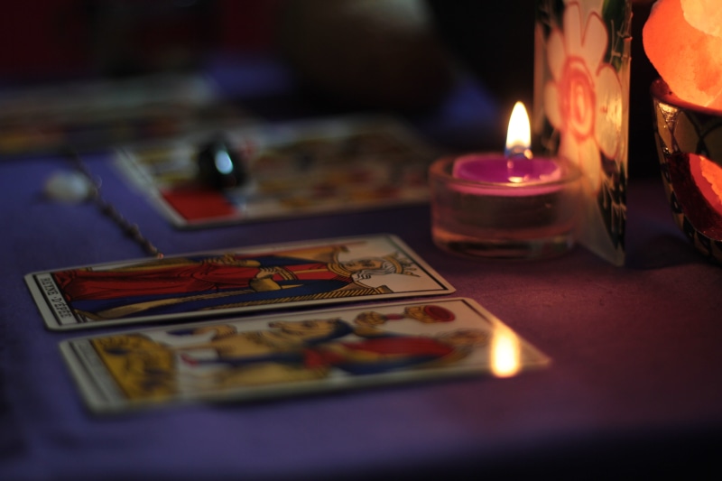 mysticism, magic, symbol, selective focus, tarot, electric lamp, representation, indoors, glowing, table, candle, illuminated, lighting equipment, human representation