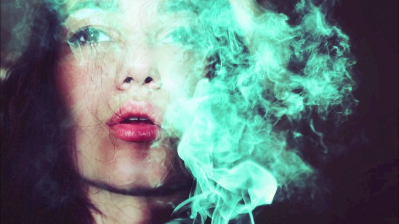 blue smoke, close-up, brunette, beautiful woman, smoking issues, young adult, activity, indoors, brown eyes, bad habit, motion, headshot, open mouth, communication