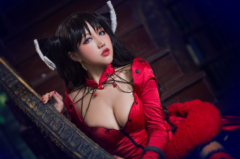 bow, heart, image, style, long-haired, girl, bangs, the dark background, red, railings, chest, makeup, hands, sitting, brunette, ladder, neckline, portrait