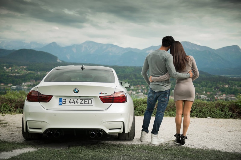 leisure activity, couple, couple - relationship, bonding, full length, togetherness, BMW M4 Coupe, men, rear view, mountain range, people, mode of transportation