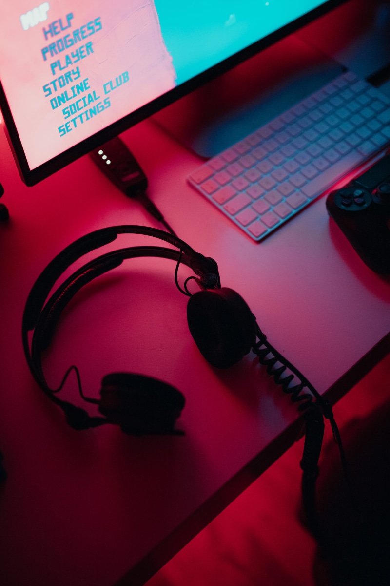 gaming, indoors, corded, technology, monitor, computer keyboard, black, turned, electronics, cassette player, headphones, hardware, table, text, wireless technology