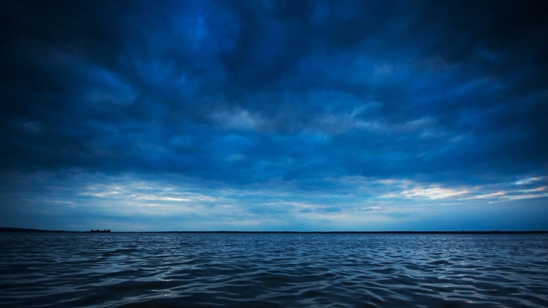 reflection, scene, day, ominous, sunset, urban skyline, sunrise, cloudscape, dark blue, water, clouds, horizon over water, waves, sky, overcast, sun, seascape