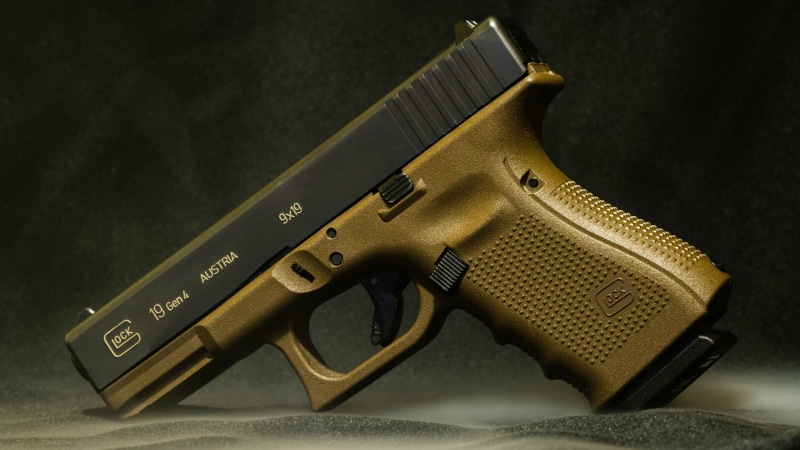 finance, indoors, warning sign, close-up, pistol, Glock, studio shot, communication, no people, economy, two objects, Glock 19, handgun, retro styled, single object