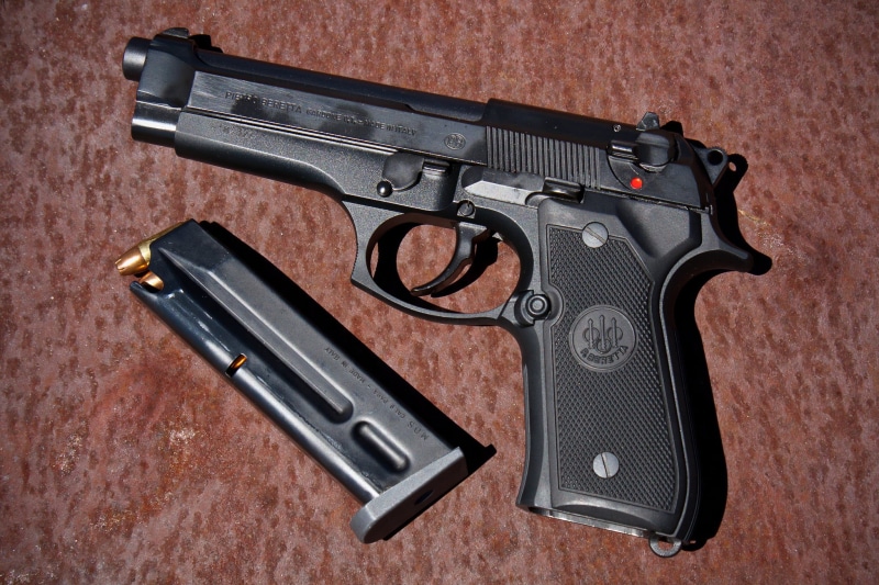 studio shot, steel, indoors, Beretta, handgun, violence, no people, weapon, alloy, gun, police force, machine gun, communication, warning sign, conflict