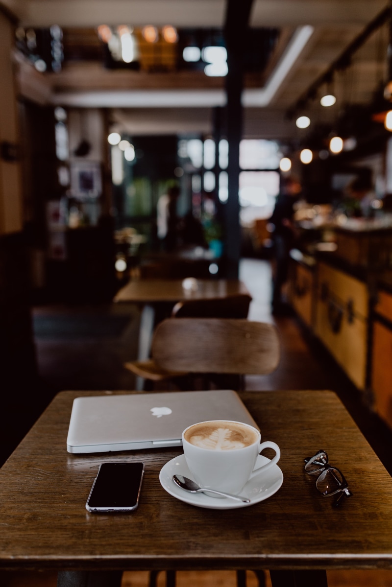 restaurant, coffee cup, food and drink, wood - material, table, freshness, hot drink, work, coffee, refreshment, working, drink, business, tech, cup, focus on foreground