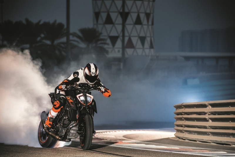 outdoors, transportation, crash helmet, ride, biker, building exterior, land vehicle, architecture, KTM, built structure, extreme sports, helmet, motorcycle