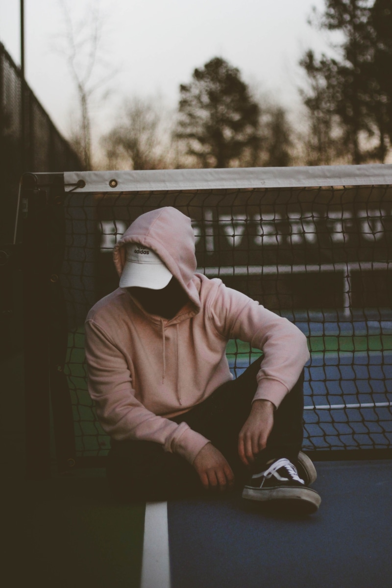 full length, 5K, front view, tennis court, man, hood - clothing, net, casual clothing, leisure activity, sitting, near, hoodie, men, lifestyles, pink