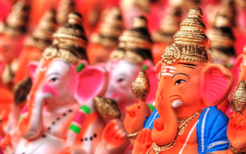 toy, large group of objects, craft, ganesh, representation, in a row, statue, sculpture, human representation, figurine, statues, close-up, ganesha, focus on foreground
