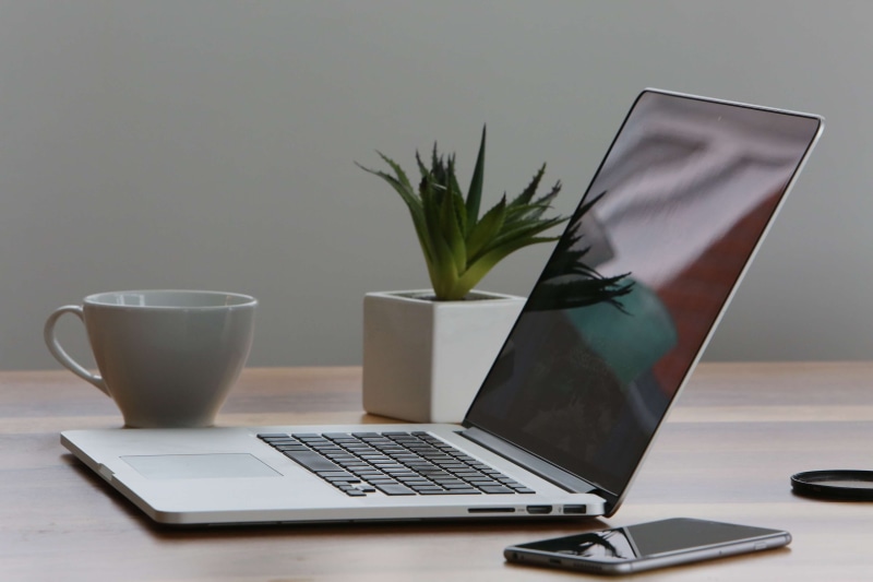 business, indoors, glass, keyboard, food and drink, connection, workspace, workplace, office, smartphone, refreshment, table, technology, still life, laptop