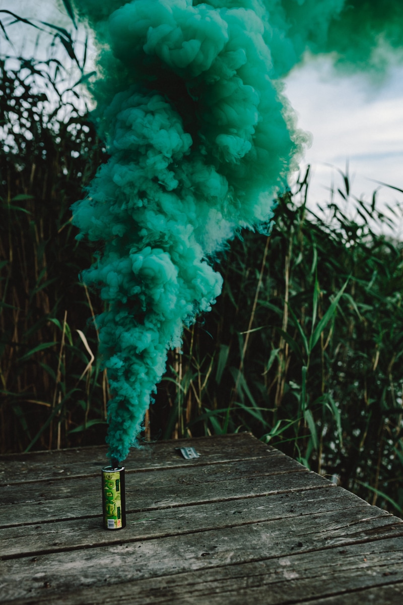 field, land, nature, beauty in nature, sky, landscape, green, bomb, no people, day, smoke, green color, tranquility, outdoor, outdoors, background, pollution