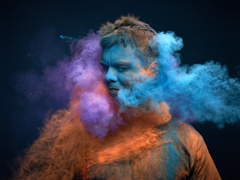 talcum powder, creativity, multi colored, obscured face, studio shot, hair, face powder, one person, teal, young adult, dust, colorful, eyes closed, black background