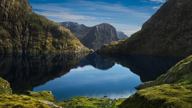 eroded, national park, tree, nature, rock, cliff, mountain range, no people, fiordland national park, water, beauty in nature, scenics - nature, reflected