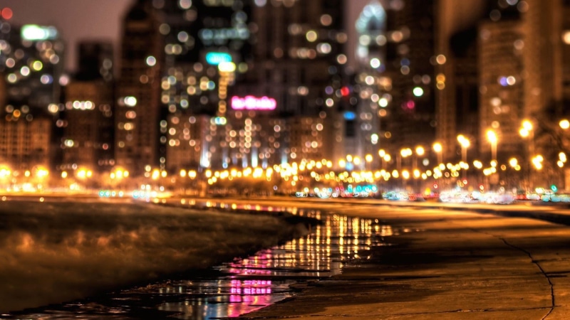 outdoors, evening, no people, street light, architecture, building exterior, traffic, city, skyline, lights, night, blurred, transportation, water, city street