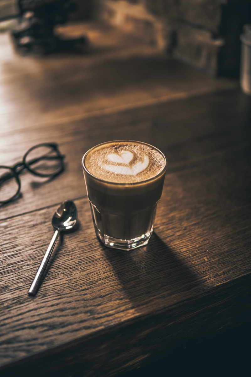 coffee - drink, cup, froth, surface, coffee, wooden, glass, heart, eating utensil, frothy drink, mug, coffee cup, coffee shop, cappuccino, still life, refreshment