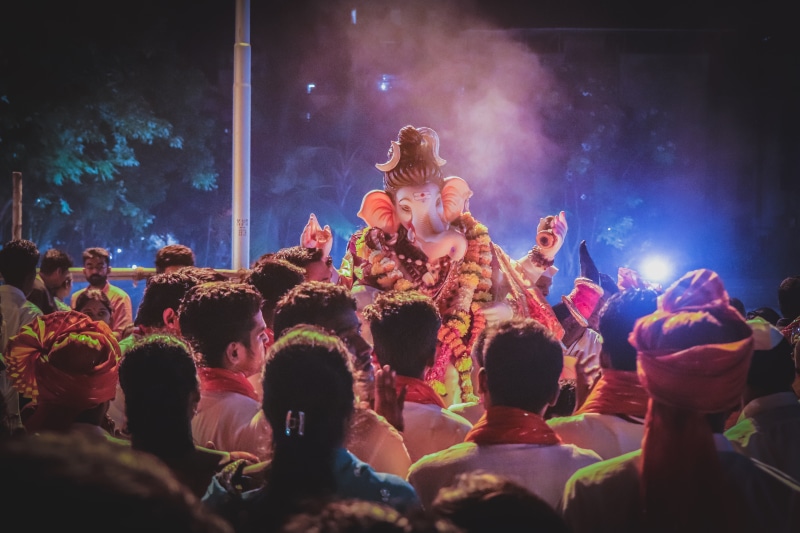 concert, prayer, real people, front, rock music, adult, stage - performance space, crowd, night, religious, spirituality, festival, spiritual, hindu, people