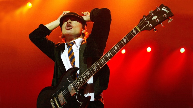 one person, mouth open, Angus Young, eyes closed, artist, pop musician, rock bands, input device, arts culture and entertainment, musician, nightlife, stage - performance space