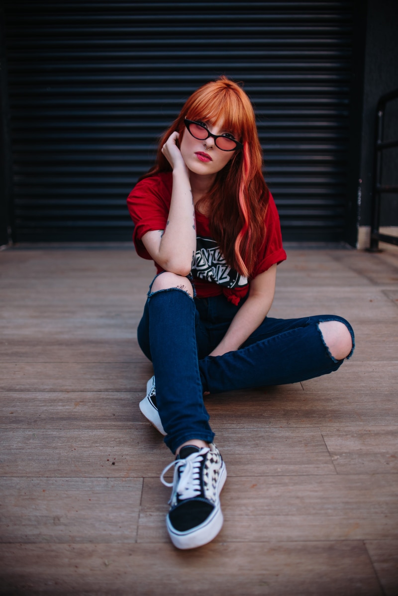 photoshoot, redhead, full length, teenager, 5K, close-up, legs, red, attractive, lady, daylight, style, skin, denim jeans, young adult, wall, top, t-shirt