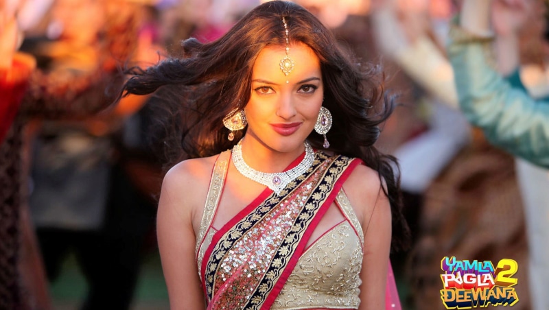 smiling, dancing, actress, event, bollywood, sari, waist up, gold, portrait, saree, traditional clothing, focus on foreground, hairstyle, dress, performance