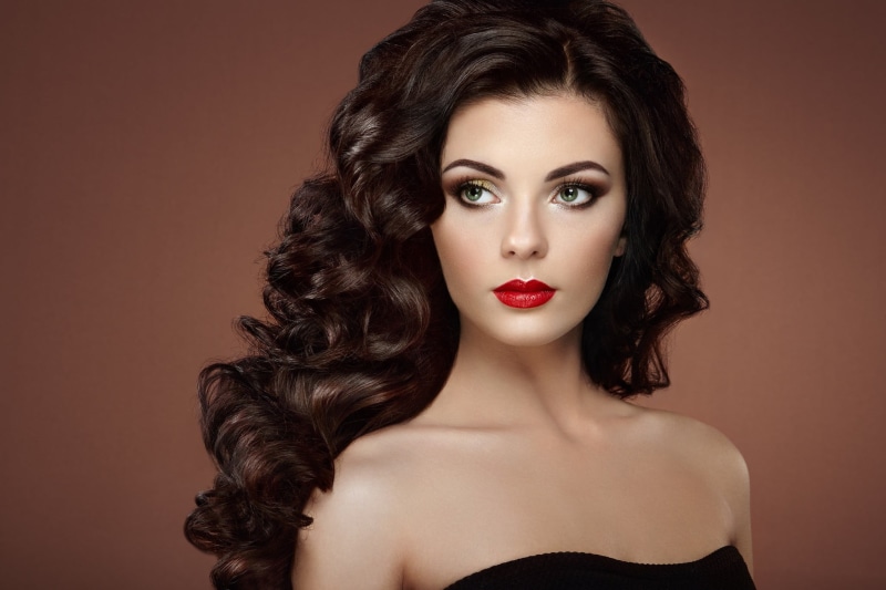 indoors, human face, wealth, red, glamour, human body part, looking at camera, women, strapless, simple background, face, black, hairstyle, model, studio shot