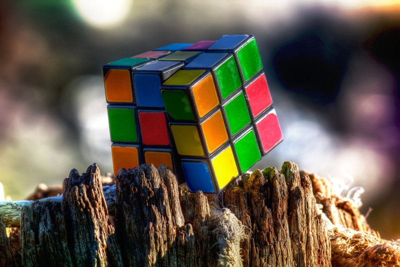 bark, still life, rock, close-up, Rubiks Cube, 2K, wood - material, toy block, no people, day, selective focus, multi colored, land, focus on foreground