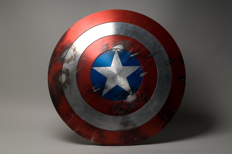 Captain America, single object, indoors, wheel, shape, no people, still life, geometric shape, security, symbol, 1080P, mode of transportation, Shield