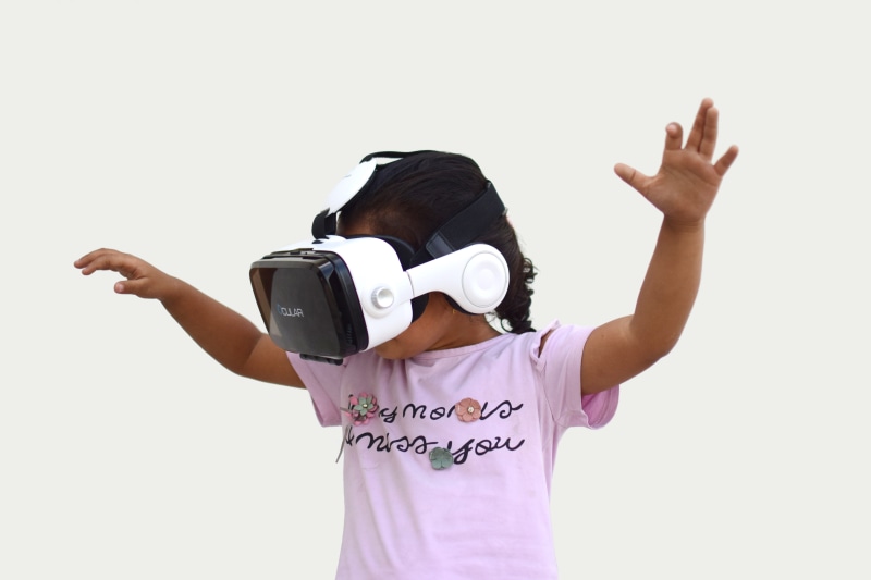 indoors, girls, childhood, kid, technology, child, holding, casual clothing, reality, virtual reality, looking, arms raised, vr, virtual, obscured face