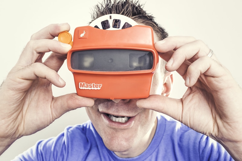 holding, neck, virtual, people, human hand, emotion, front view, Orange, adult, wearable computer, virtual reality simulator, excitement, caucasian Ethnicity