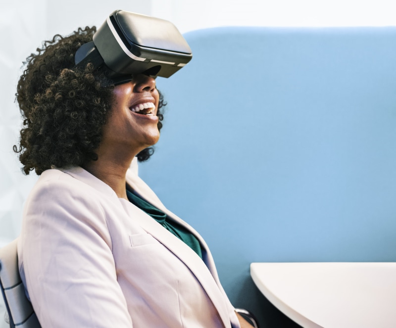 looking, wearing, adult, laughing, mature adult, virtual reality simulator, 3-d glasses, indoors, goggle, looking away, using, 2K, curly hair, woman, hairstyle