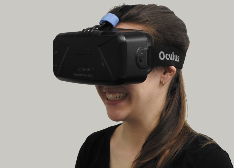 virtual reality, young adult, studio shot, text, gray, adult, entertainment, wearing, smiling, cut out, vr, visual, reality, female, oculus, close-up, hands-free device