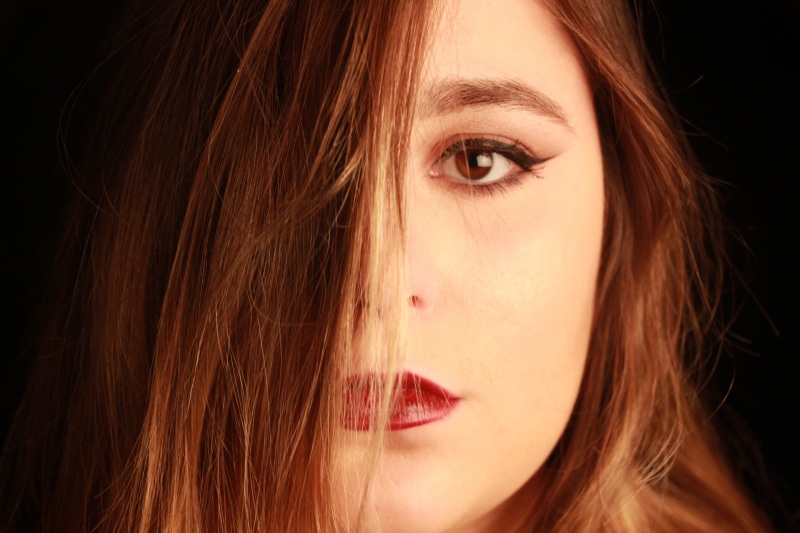 beauty, female, s, human hair, red lipstick, long hair, hairstyle, body part, black background, dyed red hair, photography, eye liner, headshot, looking at camera