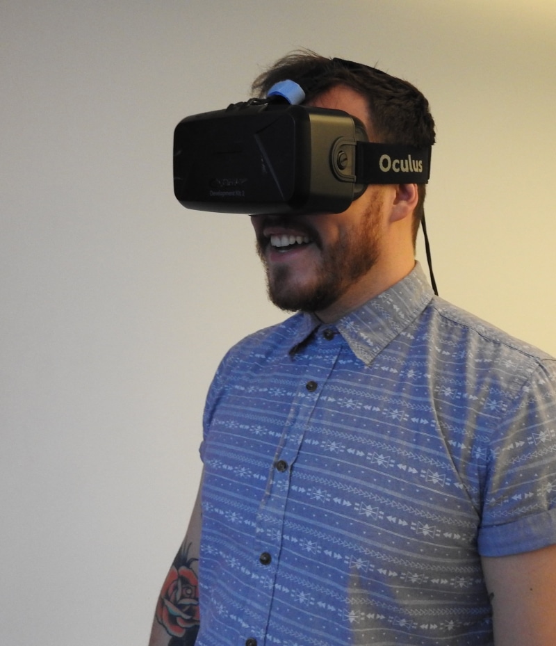 casual clothing, one person, visual, man, young adult, waist up, front view, leisure activity, young men, game, headset, virtual reality, reality, wireless technology