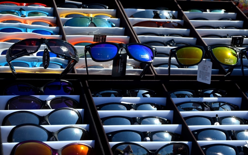 container, indoors, in a row, 4K, sun protection, repetition, sunglasses, no people, blue, uv radiation, side by side, eyes, choice, glasses, full frame