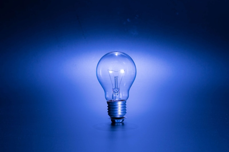 electric lamp, illuminated, blue background, bulb, inspiration, glowing, indoors, electric, studio shot, fluorescent, light - natural phenomenon, incandescent