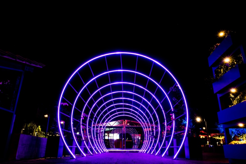 travel destinations, architecture, tunnel, glowing, built Structure, neon, amusement park, lighting Equipment, motion, arch, sky, illuminated, Night, no people