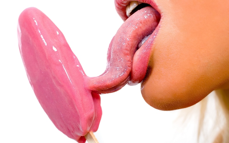 face, red, studio shot, ice cream, one person, freshness, body part, close-up, person, finger, blonde, human finger, lips, licking, indoors, drop, wet