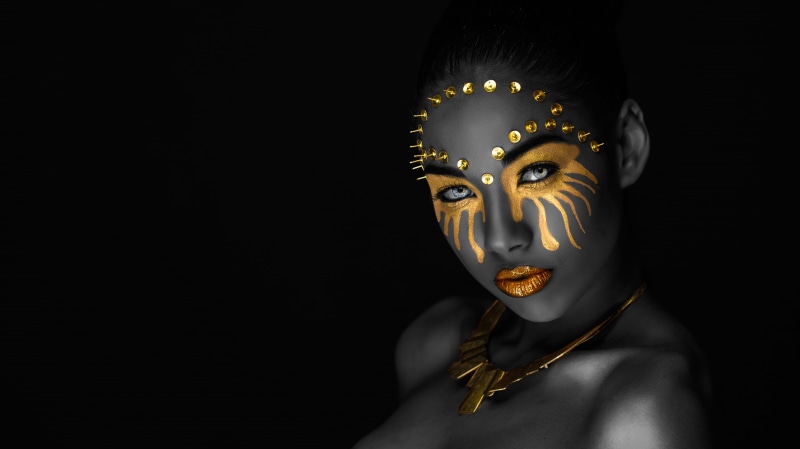 image, makeup, necklace, black, black background, shoulders, mask, mulatto, eyes, 2K, gold plated, lips, face, portrait, grey, look, style, decoration