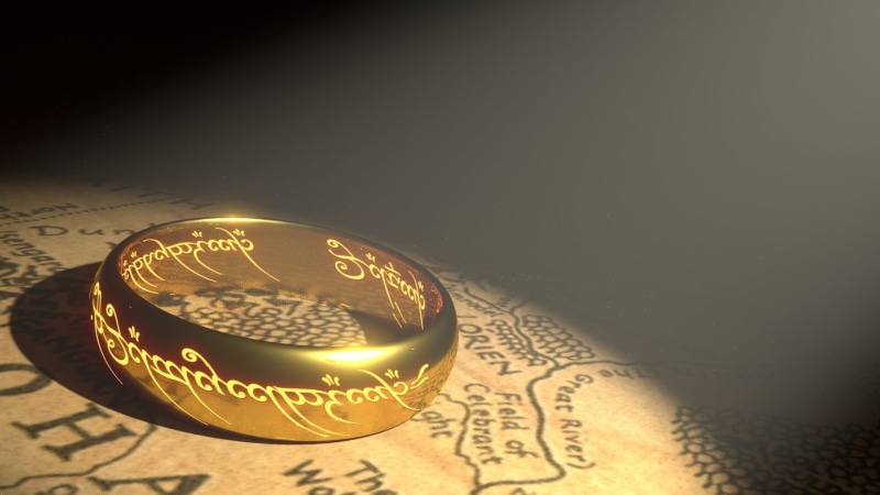 rings, communication, close-up, still life, sphere, colored, map, western script, business, high angle view, dark, economy, indoors, ring, no people, finance