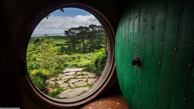 circle, built structure, water, wood - material, day, outdoors, nature, green color, entrance, geometric shape, plant, sky, the hobbit bag end the shire the lord of the rings bilbo baggins frodo baggins house hobbits middle earth