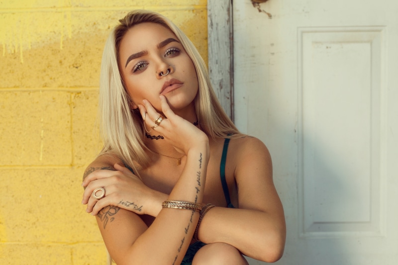 nose rings, hair, leisure activity, adult, women, wall - building feature, blond hair, front view, tattoo, beauty, jewels, 5K, young adult, portrait, one person