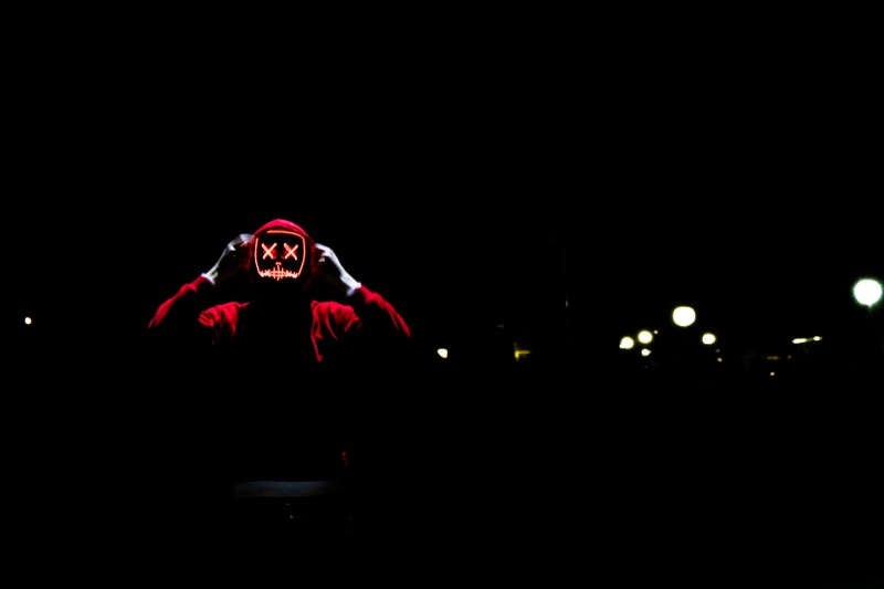 marshmello, mask, red, illuminated, young adult, hoodie, black background, three quarter length, night, clothing, wearing, standing, double, costume, color