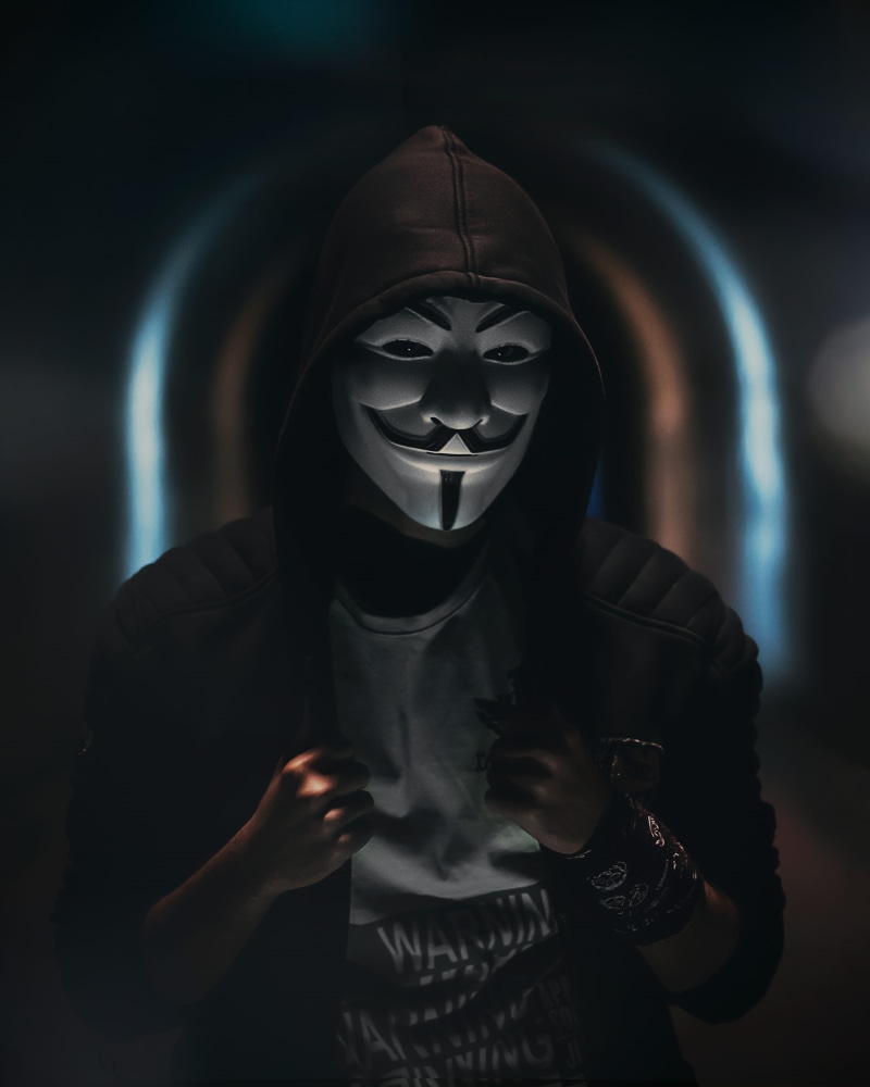 indoors, tunnel, focus on foreground, waist up, apparel, disguise, batman, one person, hoodie, colour, dark, moody, head, urban, hood - clothing, person