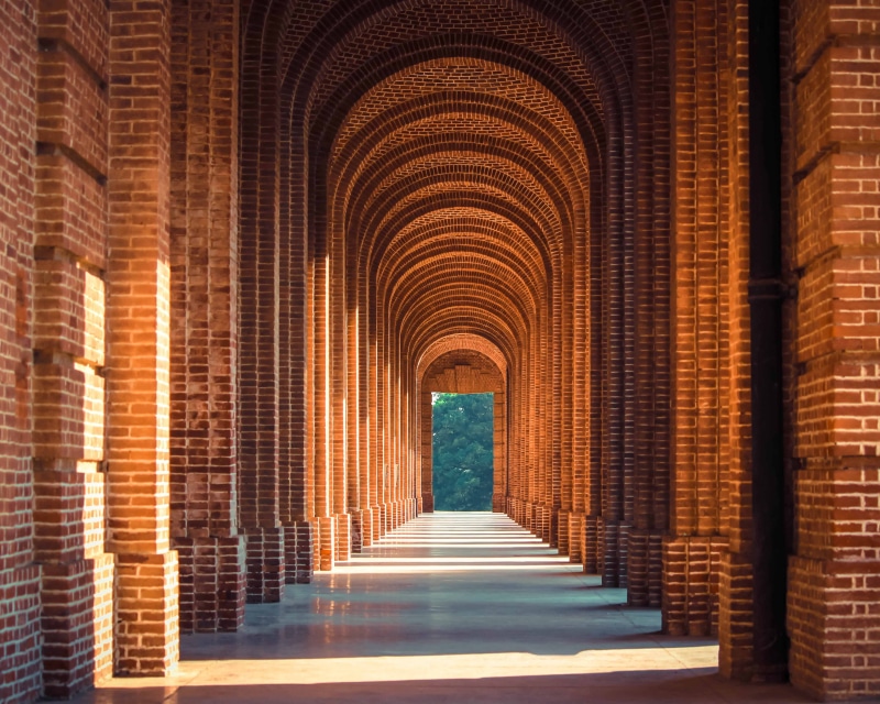indoors, no People, arch, ceiling, pathway, travel destinations, tunnel, architectural column, corridor, religion, day, color Image, direction, sunlight
