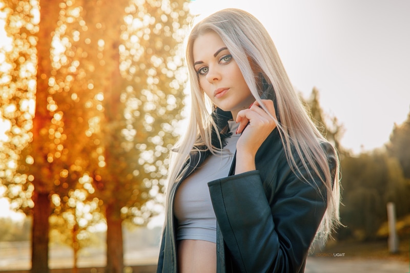 women, Alexander Drobkov, outdoors, looking at viewer, crop top, backlighting, trees, leather jackets, red nails, depth of field, 2K, model, women outdoors