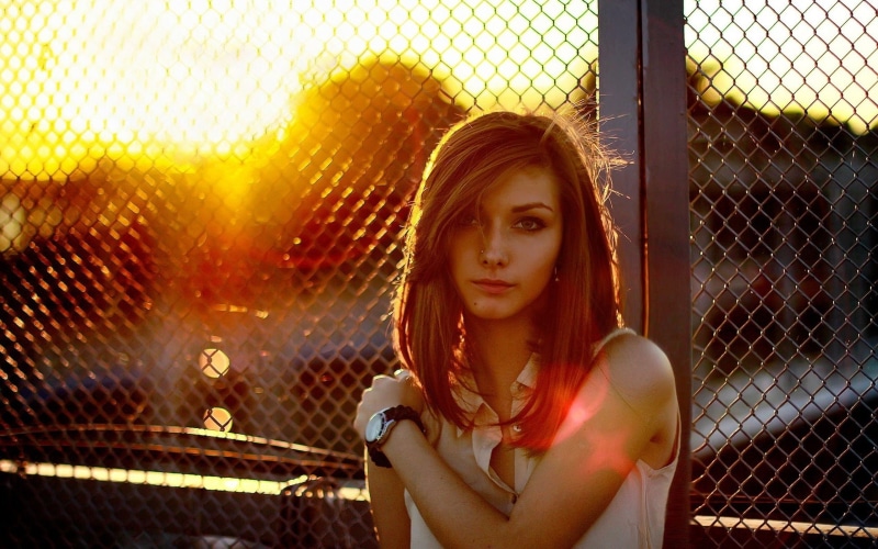 barrier, outdoors, real people, front view, boundary, contemplation, young women, long hair, looking at viewer, collared, beautiful woman, pierced nose