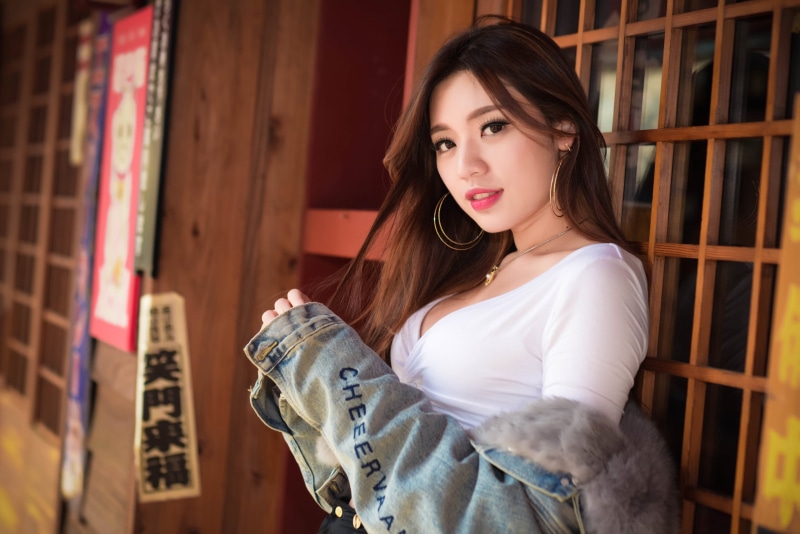 white tops, brown eyes, portrait, model, smiling, jacket, women outdoors, red lipstick, necklace, depth of field, jeans jacket, 2K, Kiki Hsieh, looking at viewer