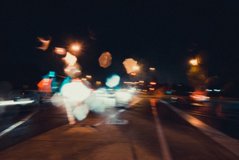 blur aesthetic, motor vehicle, street, 35mm, 5K, on the move, one person, architecture, real people, mode of transportation, motion, blurred motion, vintage