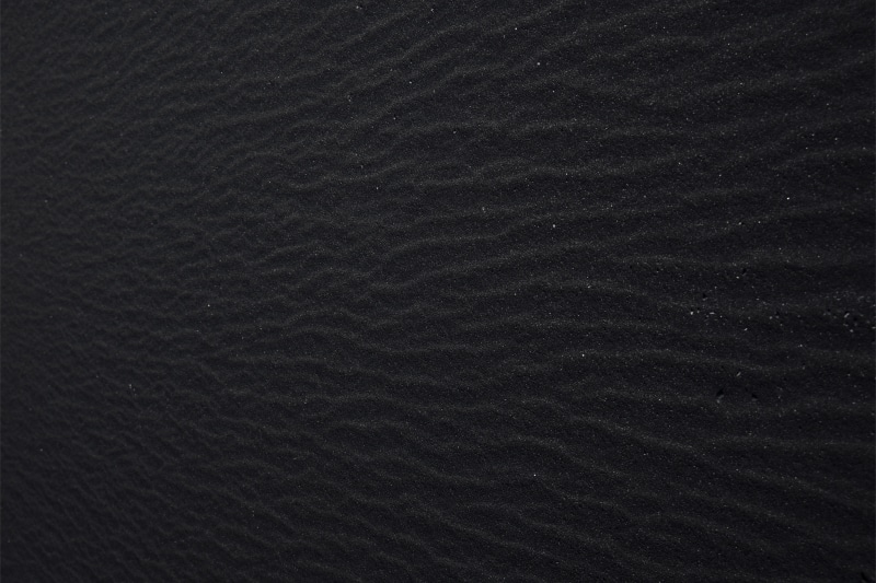 soil, land, high angle view, indoors, black color, natural pattern, texture, close-up, material, 5K, nature, rough, beach, pattern, black background, backgrounds
