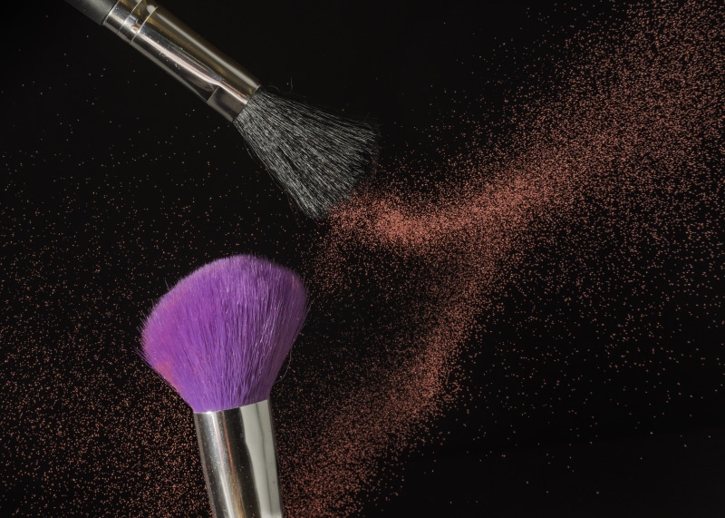 texture, variation, indoors, face powder, beauty, still life, color, close-up, body care, sand, blush - make-up, black, purple, dust, motion, black background